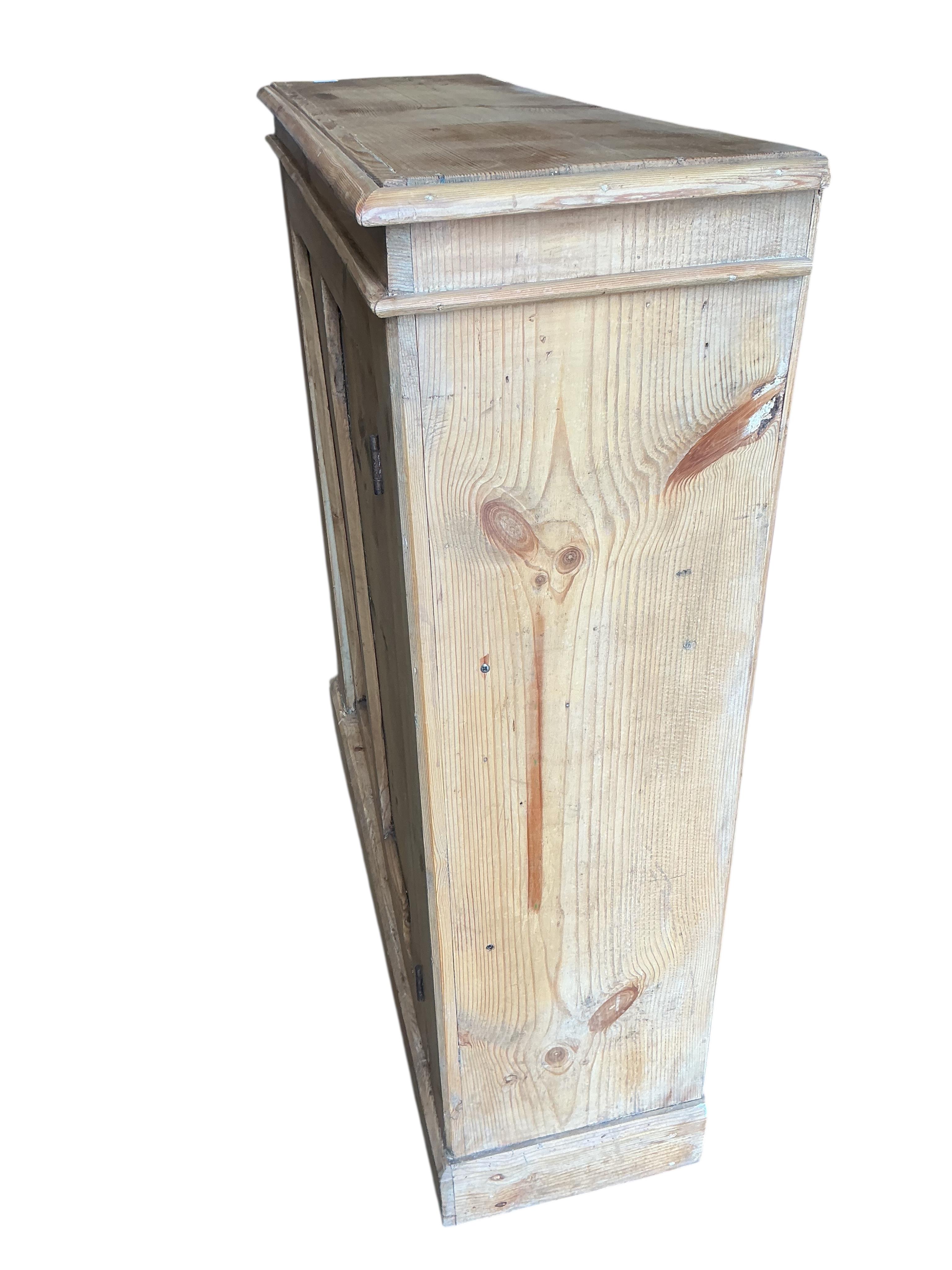 A Victorian pine single door side cabinet, width 100cm, depth 31cm, height 107cm
